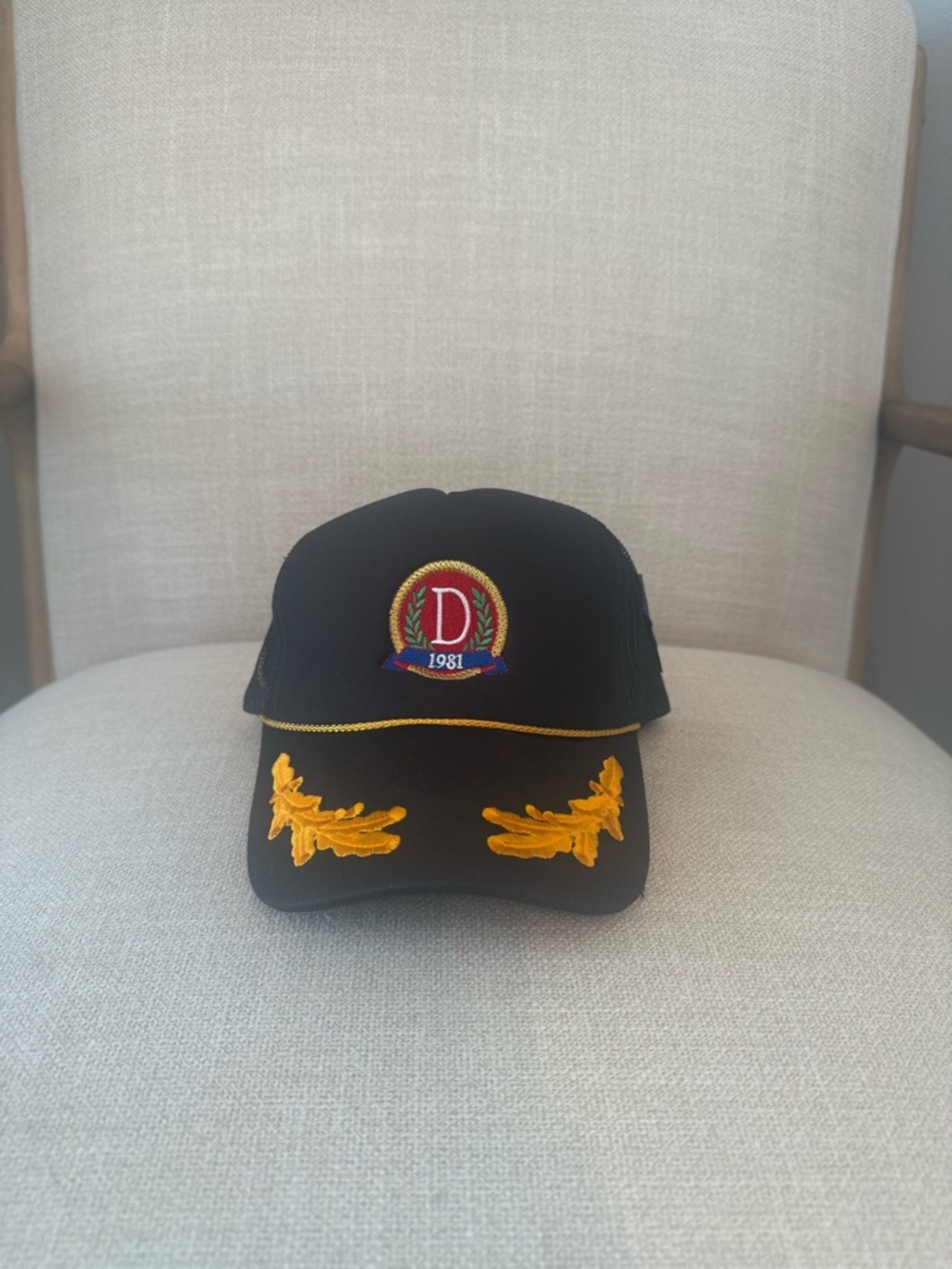 Danzy Black Logo Trucker Hat